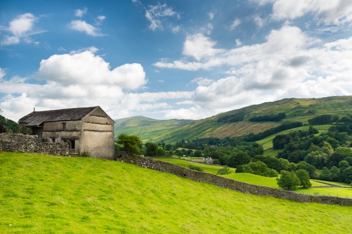 An old stone house overlooking the valley below Troutbeck situated along the old coach road from Windermere to Penrith